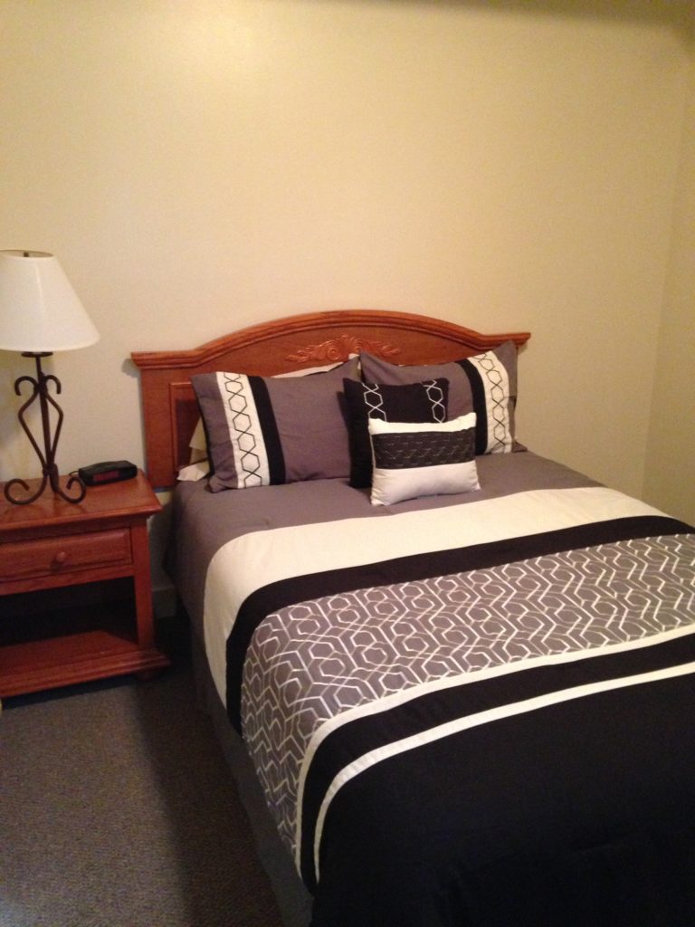 Remodeled Room with bed and night stand