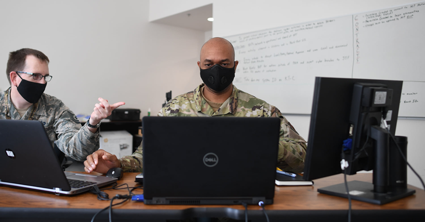 Military Personnel working with computers